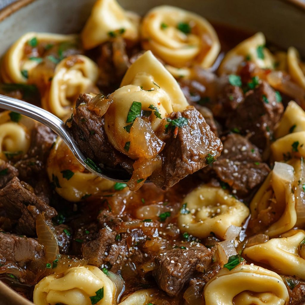 Bowl of French Onion Beef and Tortellini served warm